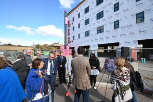 Guests observing the renderings of the upcoming project.