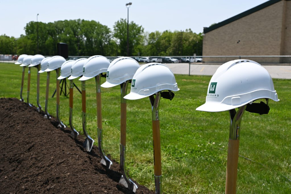 Leo Fieldhouse Groundbreaking | Weigand Construction Helmets and Shovels