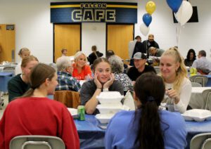 Students and families at the cafe